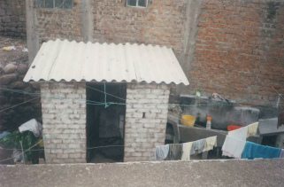 Toilet of the neighbour without curtain with corrugated
            iron roof